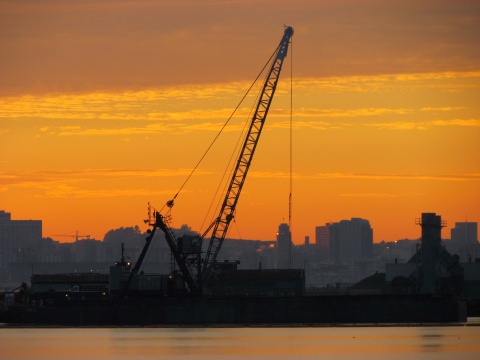 Dredging the northwest corner of Seaplane Lagoon at sundown