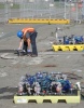 Site 27 - Contractor making the rounds injecting chemicals. Pump/extraction apparatus on skids. (Alameda Point Info photo)